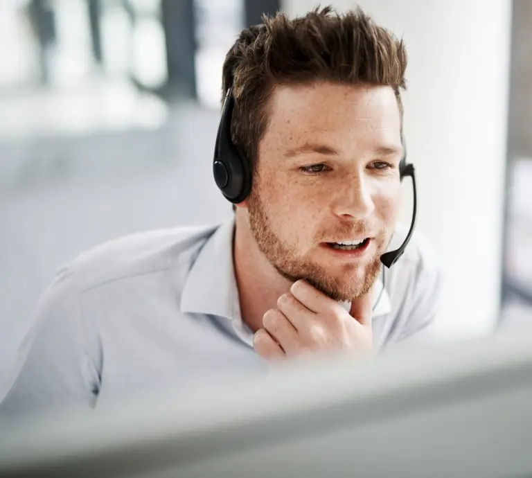 Technical support working wearing headset.